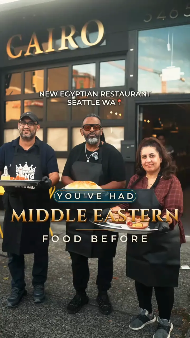 Three members of the Cairo Restaurant & Lounge team in black aprons holding trays of Egyptian dishes outside the Ballard storefront, with the on-screen hook You've had Middle Eastern food before